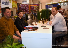 John de Wilde (right) talking to some of his suppliers.